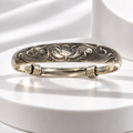 The Lotus Bracelet Fish & Lotus Engraved Silver-Tone Bangle — Pre-Loved.