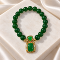 Emerald Green Beaded Bracelet with Vintage-Inspired Statement Charm